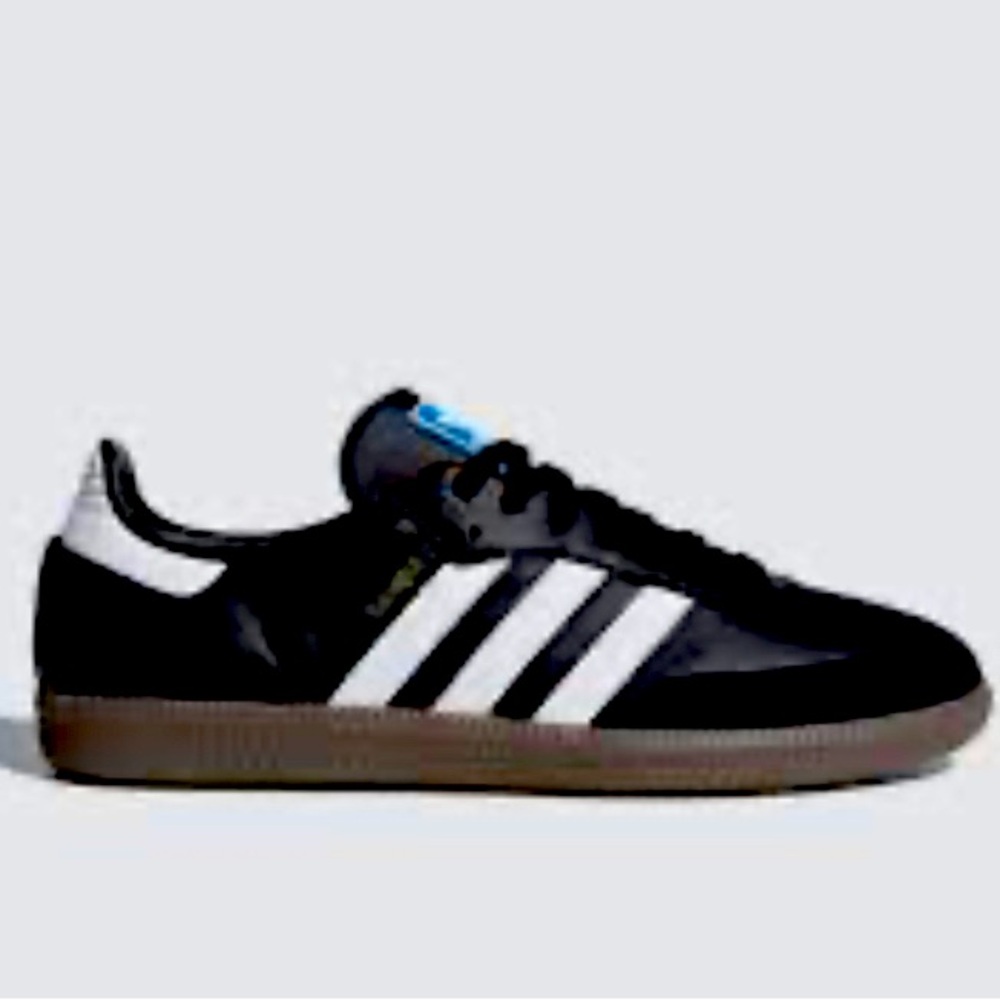 Mens Adidas black ad white striped sambas.